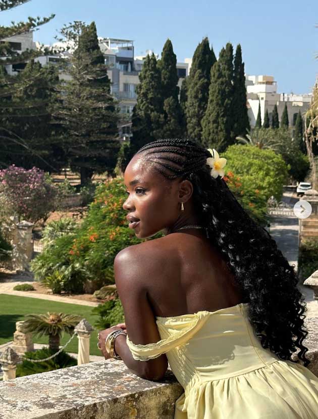 princesscore summer hairstyle for black woman dark skin locs with braids and butter yellow aesthetic claw clip
