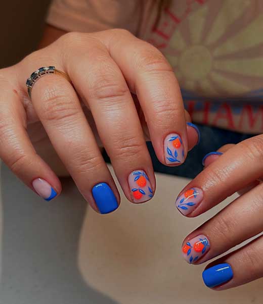 short blue nails with neon orange fruits