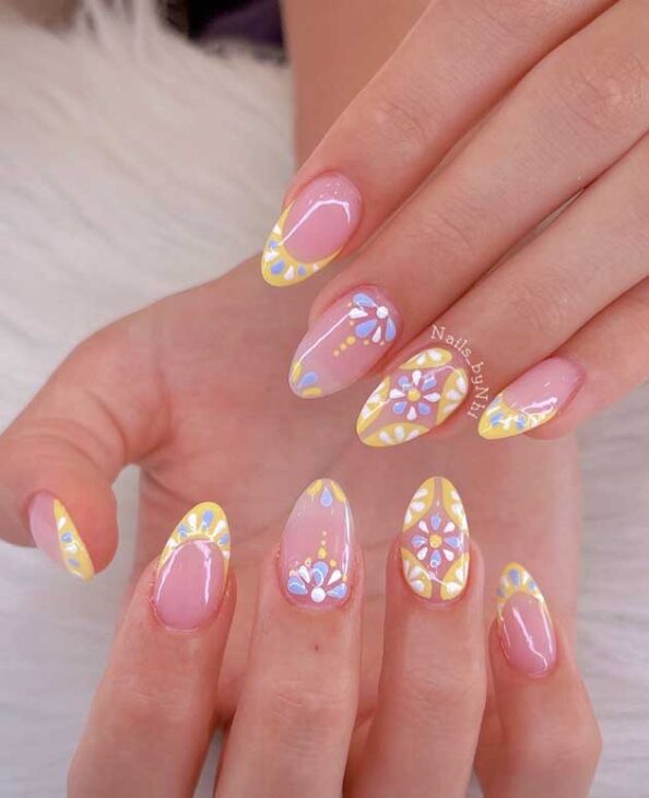 butter yellow design on nude nails for spring and summer. cute and feminine