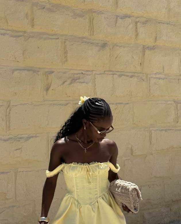 black woman dark skin cute half up half down summer hairstyle with locs and butter yellow aesthetic clips
