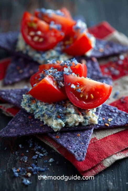4th of july Cherry tomato and blue core chip bites with humus
