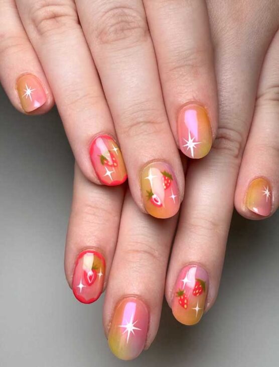 cute and colorful ombre simmer nails on short nails in orange and pink with fruits design