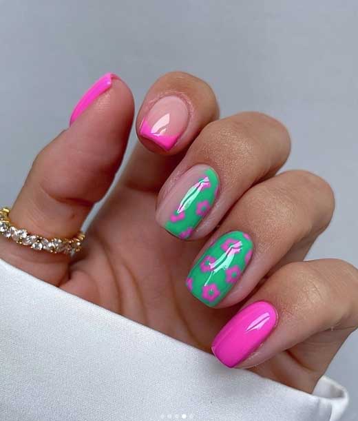 neon pink and neon green short summer nails with flowers