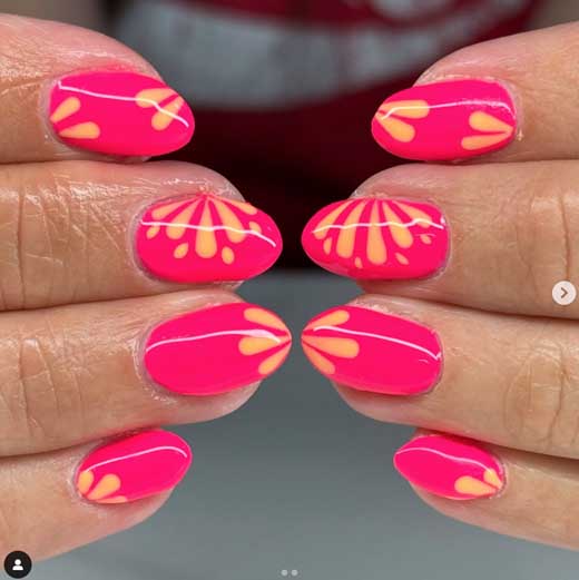 bright pink neon almond nails with cute flowers