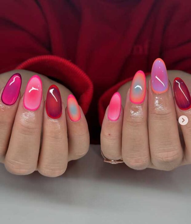 neon ombre summer nails with aura effect and red and neon pink nail polish on almond nails