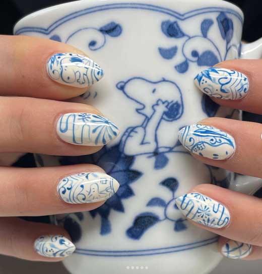 ceramic white and blue snoopy nails doodle nail art for school