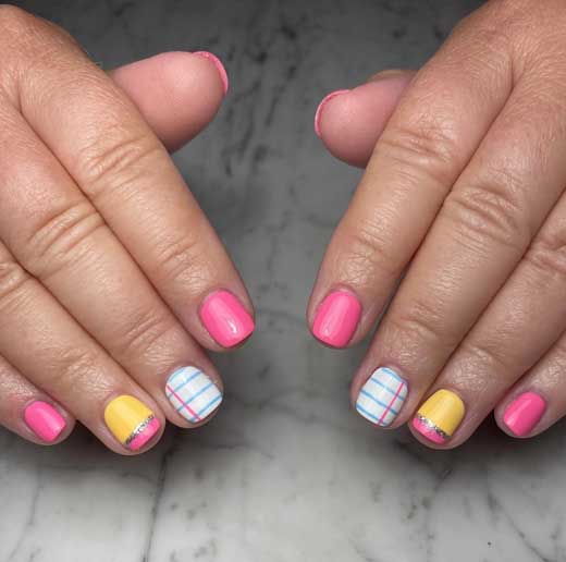 pink and yellow with light blue notebook design back to school nails on short nails