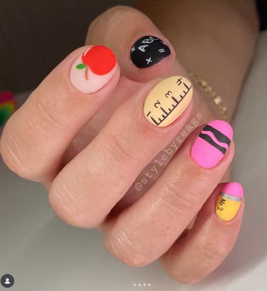 handpainted back to school short nails with pencil, ruler and apple design on short almond nails