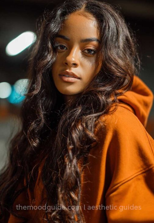 baddie quick and easy long hair down hairstyle on wavy brown hair