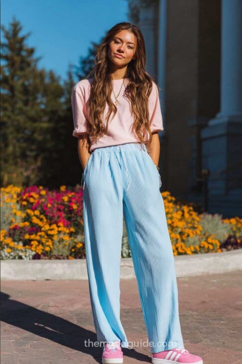colorful cute casual wide ribbed light blue pants back to school outfit with soft pastel light pink blouse and pink adidas