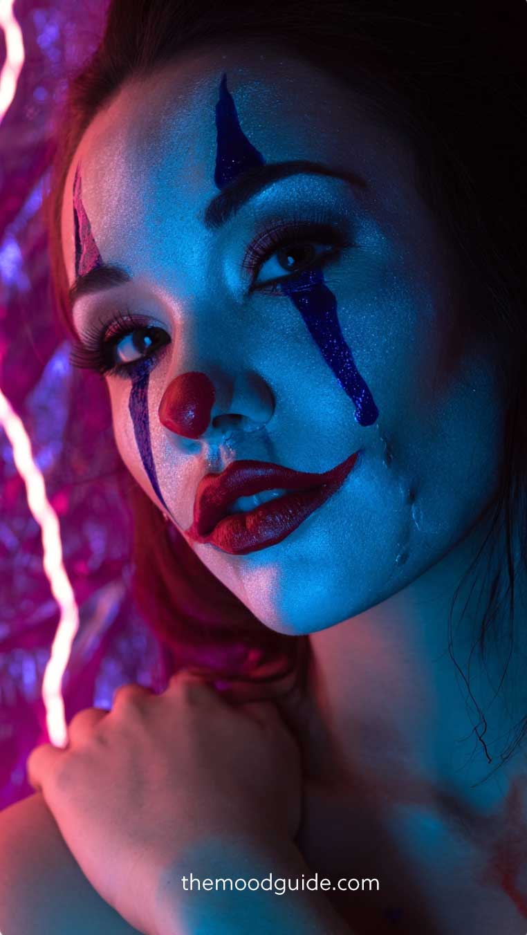 classic red and blue clown makeup for halloween with tears