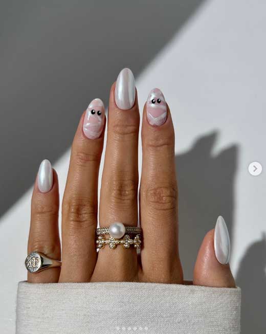 cute mummy nails on almond nails for halloween