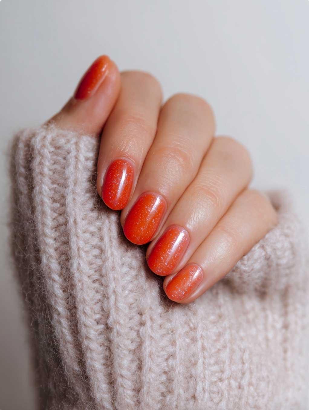glittery orange almond short nails