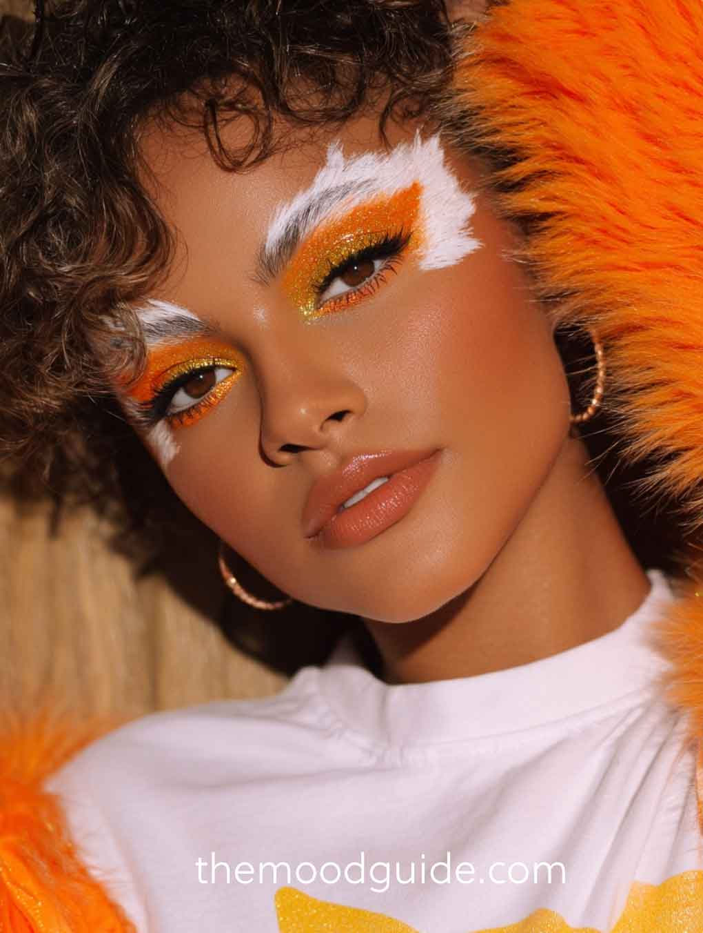 orange, gold and white easy fox makeup on brown skin