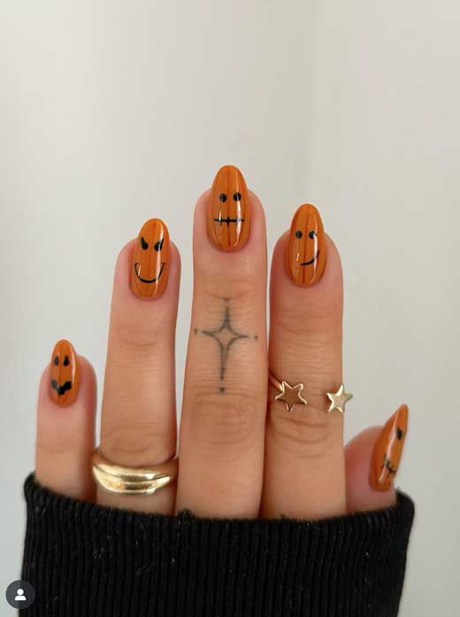 orange pumpkin nails with black faces