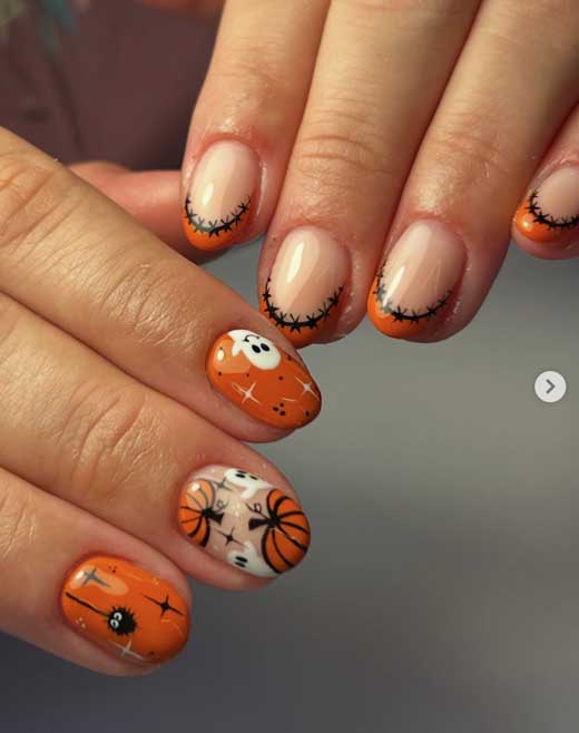 cute orange pumpkin halloween nails on short almond nails