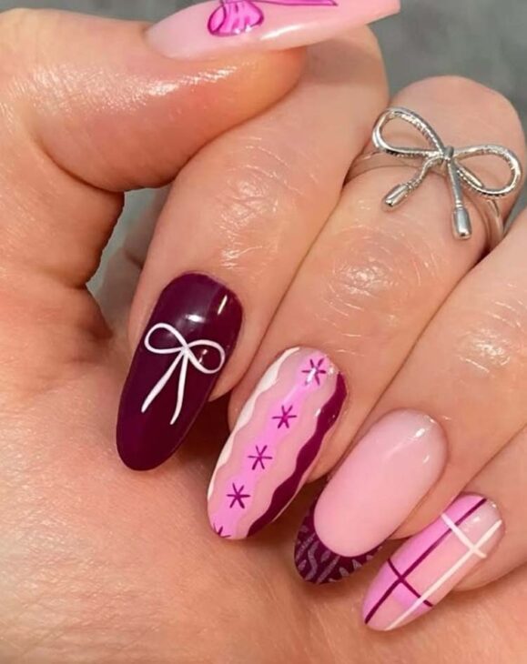 burgundy and pink christmas nail art with white gown and plaid design