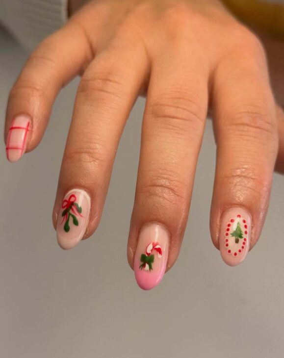 cute christmas nails with pink beige and, holly berry and candy cane hand drawn doodles