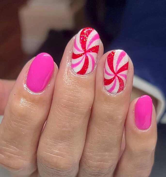 pink nails with white, red and gold design