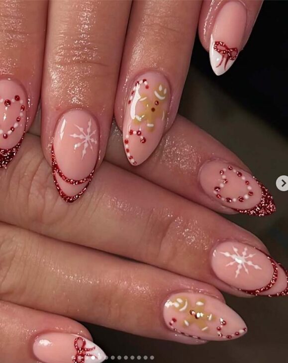 glittery tips on nude base red and white christmas nails with gingerbread cookie