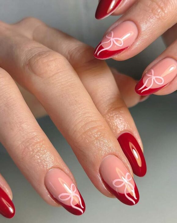 minimalist red nails with pink bows for christmas
