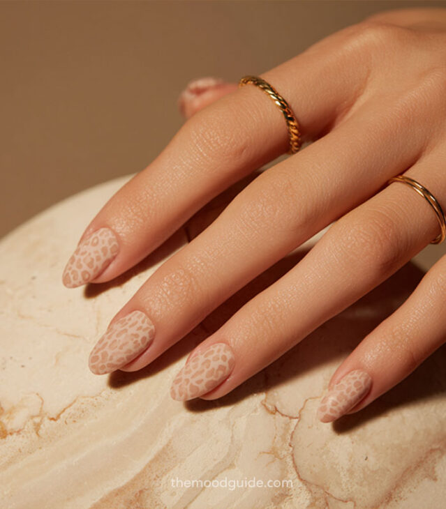 nude matte almond nails with light brown leopard print art