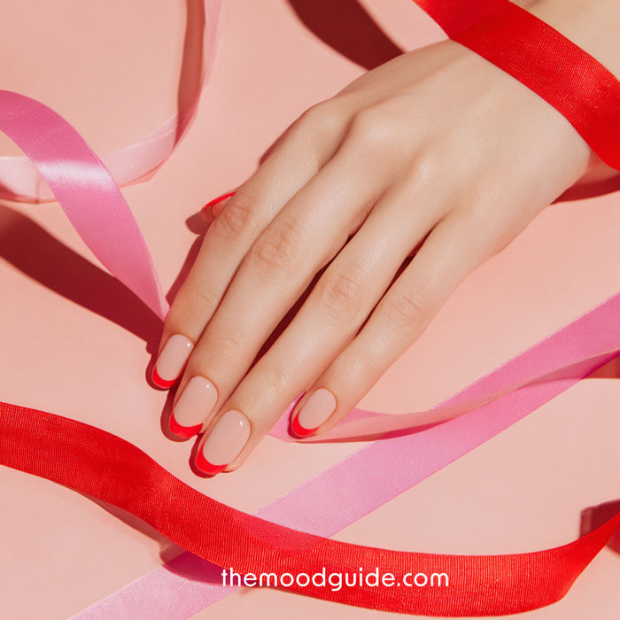 simple easy red French tips on nude base for valentines day manicure nails