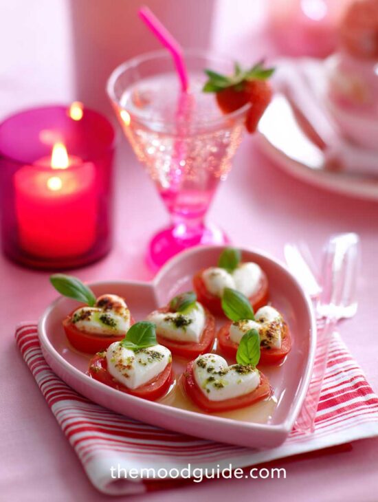 cute appetizer table setting for easy valentines day dinner with mozzarella cheese and tomato