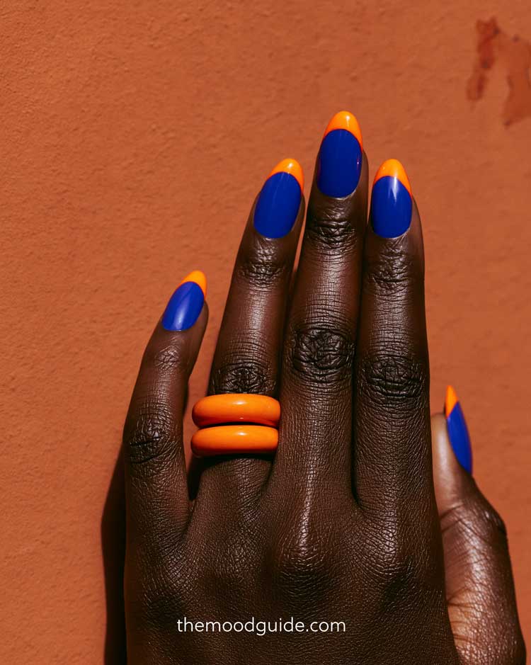 blue and orangy sommer nails on black skin with complementary colors.