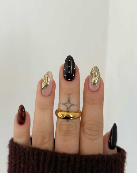 one finger accent polka dot nail design with gold chrome for luxury aesthetic nails