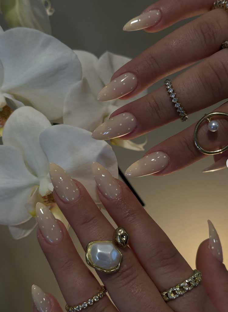neutral simple elegant polka dot nails on nude base with white small polka dots