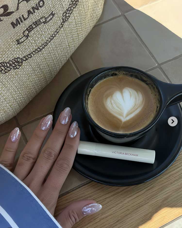 clean girl aesthetic small white polka dot nail art on chrome design