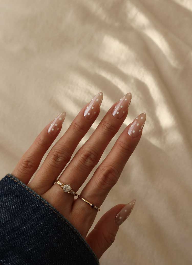 pearly elegant easy simple white polka dot nails on nude base
