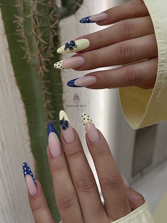 light yellow and navy blue blueberry nails with polka dots for summer