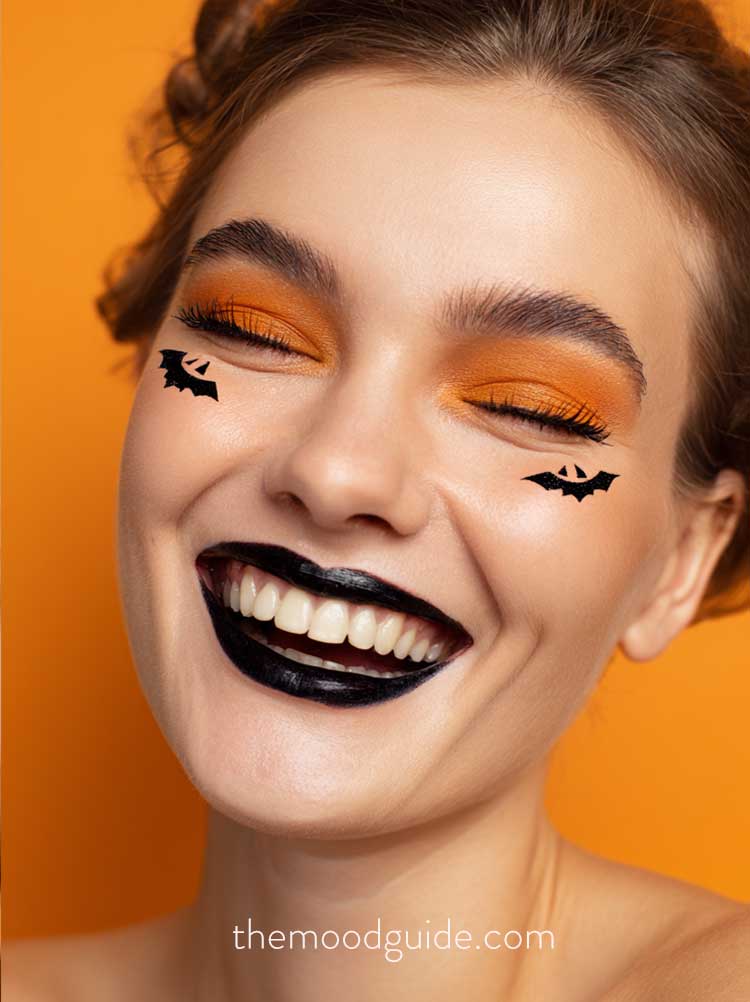 orange eye makeup. jack o lantern makeup for halloween